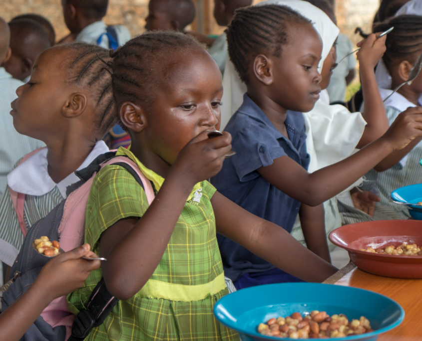 Children practice using the new spoons