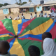 Hannah teaching DGS Children a Parachute Game