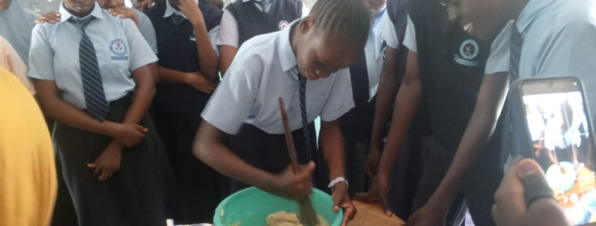 Charcoal Baking birthday cake Destiny Garden School, Kenya